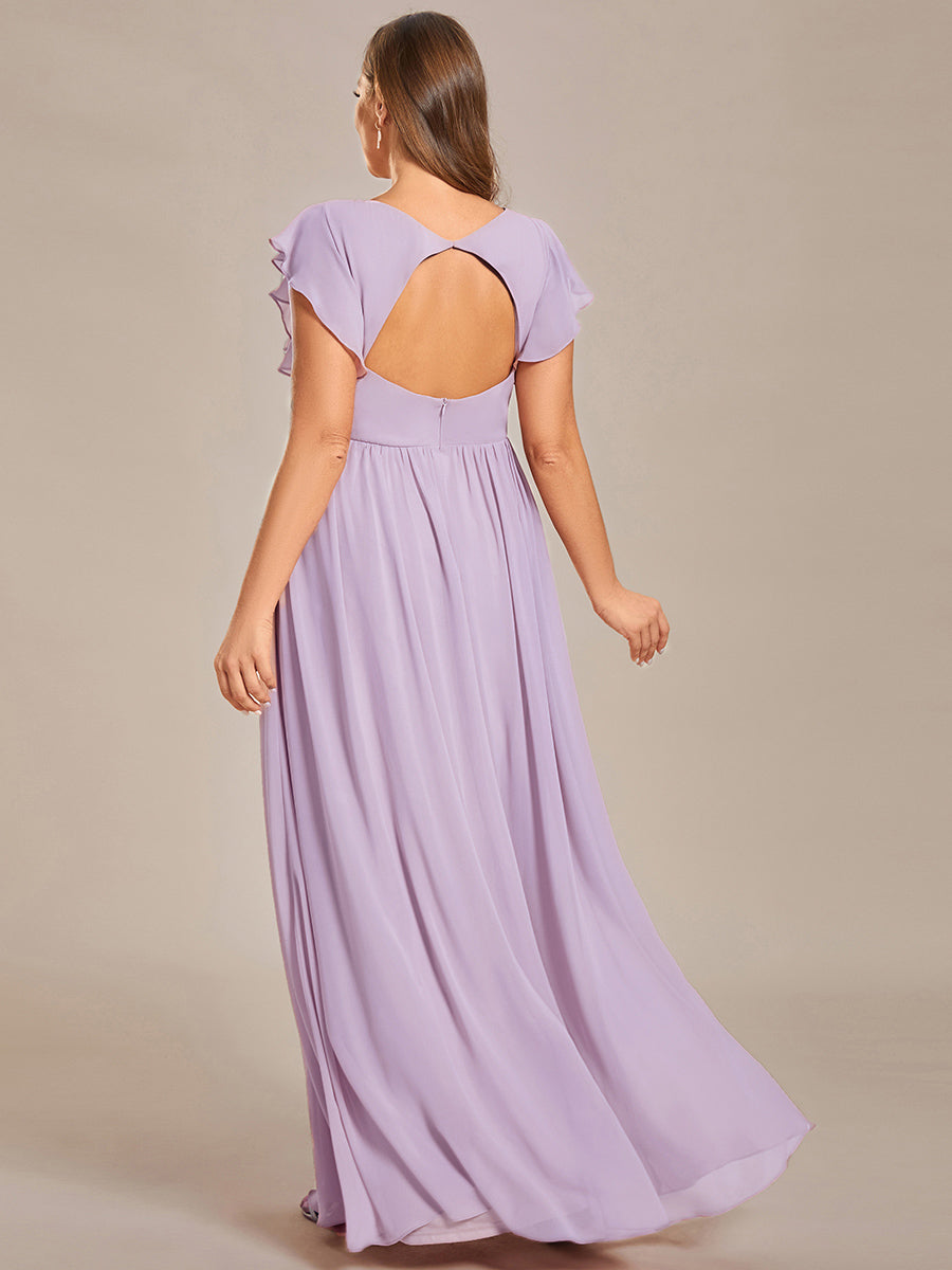 Robe de cérémonie femme, dos ouvert, col en V. Longue et fluide pour un look estival parfait et féminin.