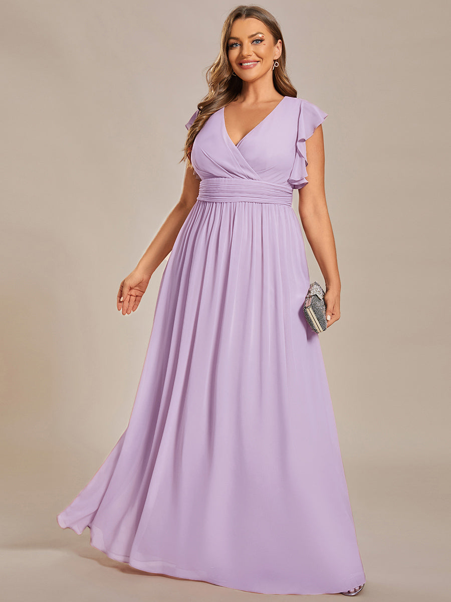 Robe de fête élégante, dos ouvert, manches courtes. Fluide et maxi pour une femme chic et rayonnante.