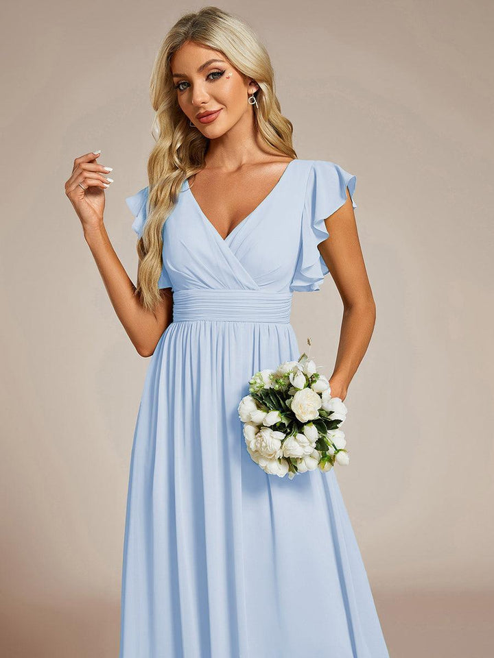 Robe fluide, dos ouvert, longueur maxi. Élégante pour demoiselle d'honneur ou cérémonie estivale.