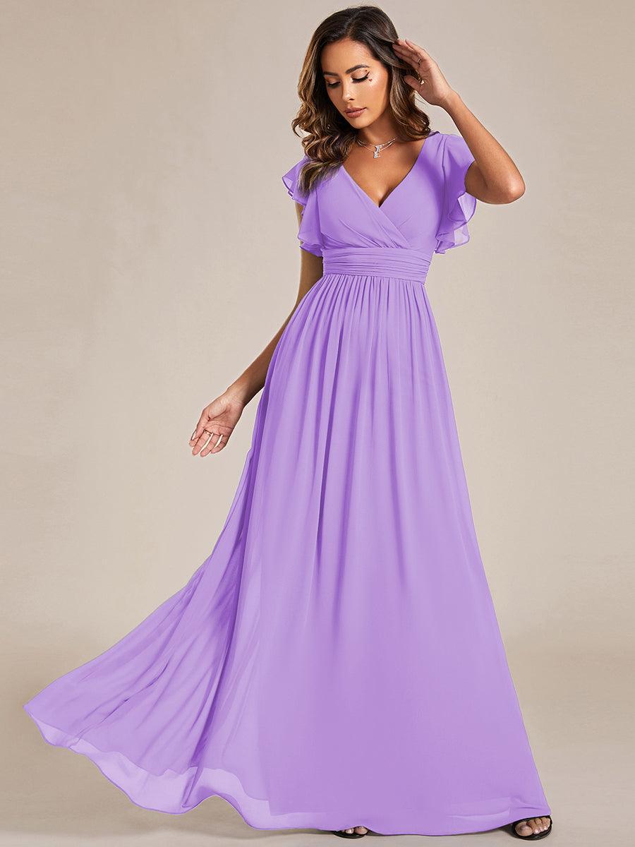 Robe de femme, dos ouvert, col en V. Élégante pour une soirée, mariage ou fête de printemps.
