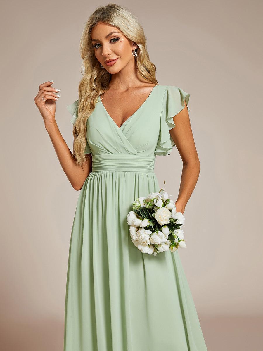Robe longue femme, dos ouvert, manches courtes. Élégante et fluide pour un événement spécial.