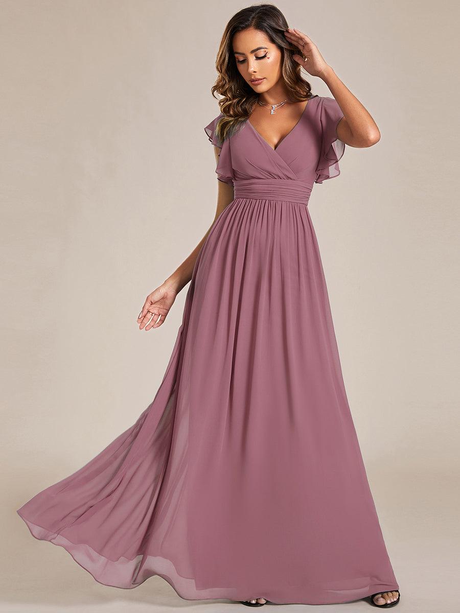 Robe longue femme, dos ouvert, col en V. Élégante pour une cérémonie ou soirée de printemps chic.