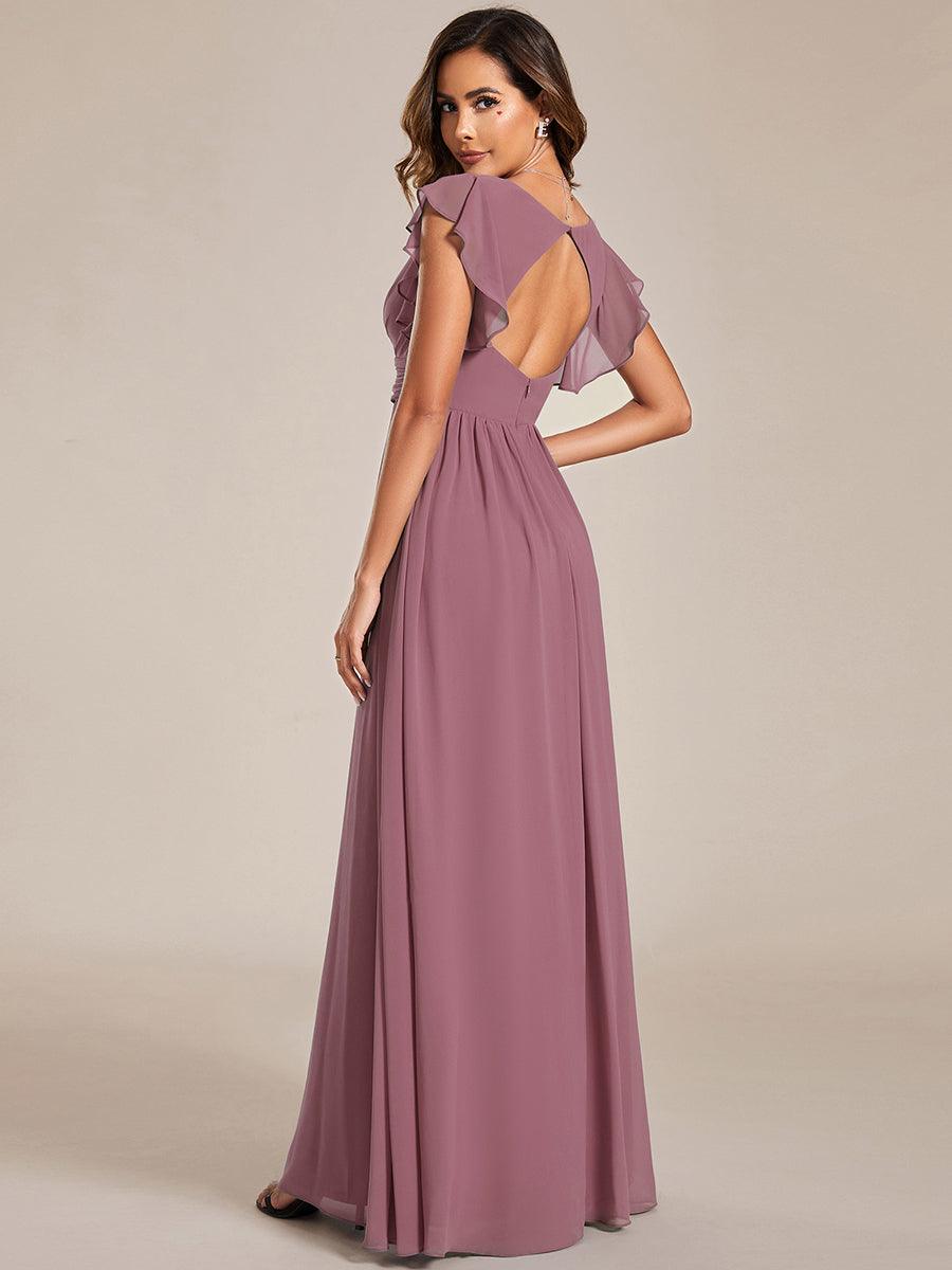 Robe de demoiselle d'honneur élégante, dos ouvert. Fluide et longue pour un mariage d'été raffiné.