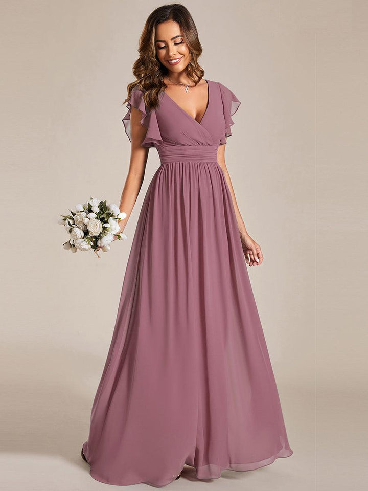 Robe de cérémonie femme, dos ouvert, col en V. Longue et fluide, parfaite pour le printemps et l'été.