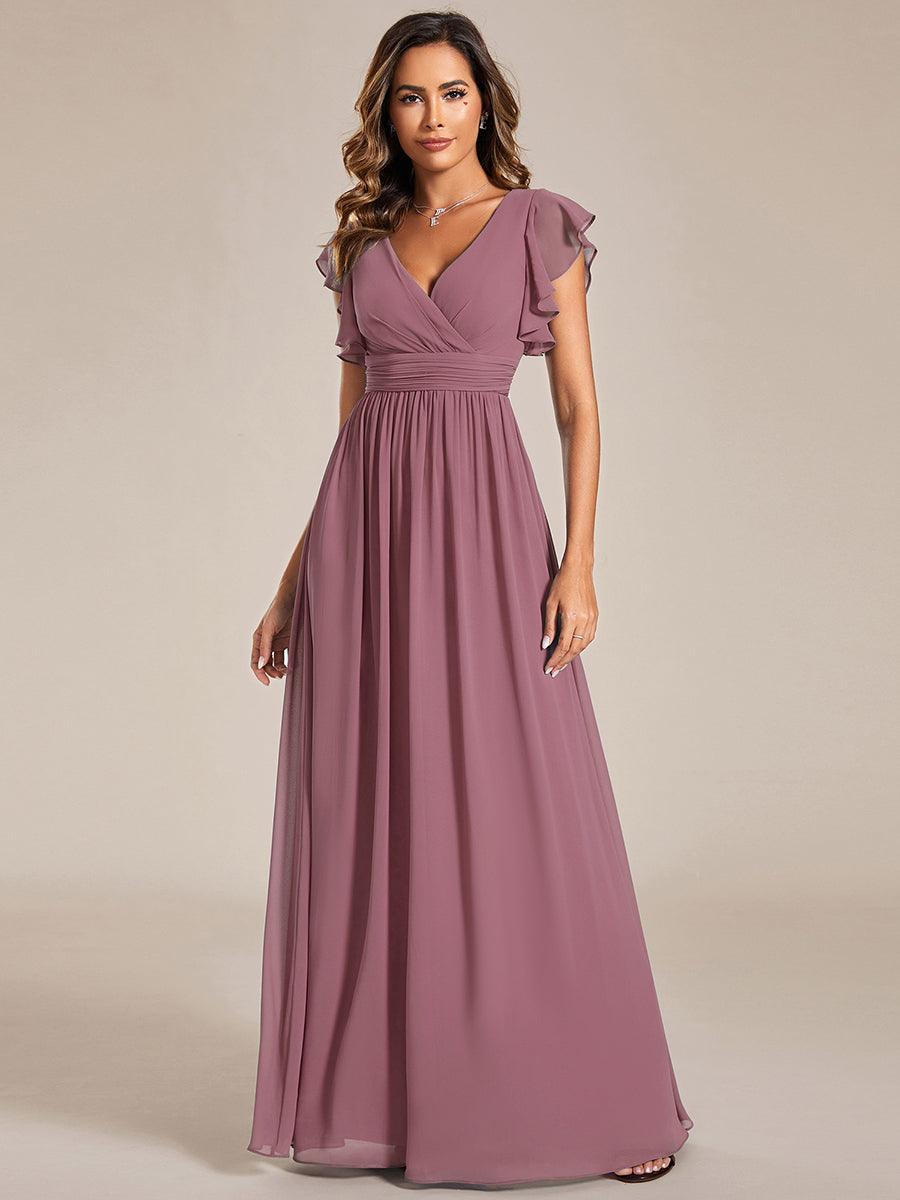 Robe élégante, dos ouvert, col en V, fluide. Idéale pour demoiselle d'honneur, soirée ou mariage chic.