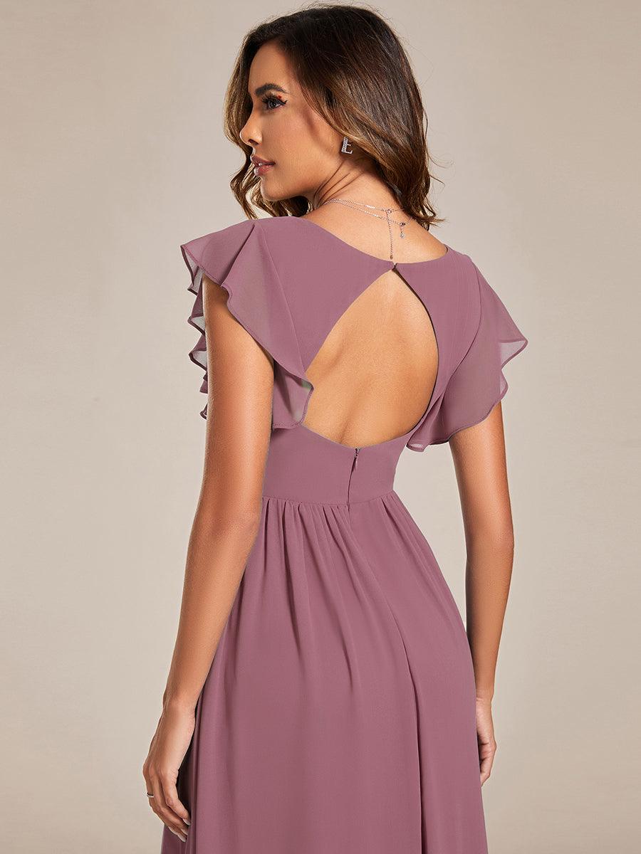 Robe de soirée chic, dos ouvert, manches courtes. Maxi et fluide pour une fête élégante et décontractée.