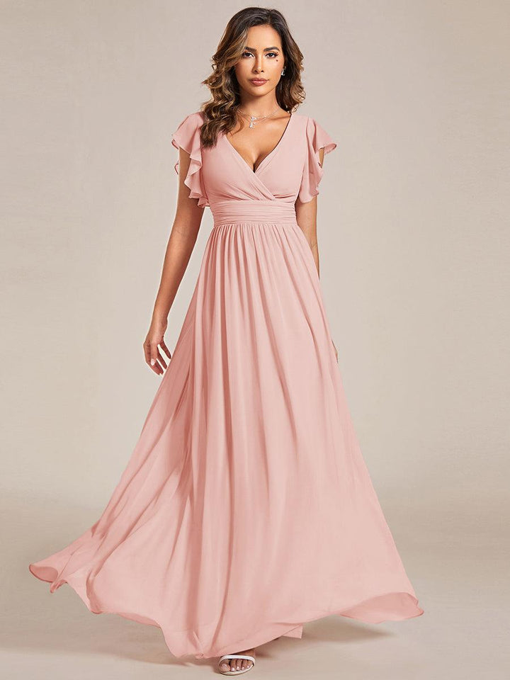 Robe de cérémonie femme, dos ouvert, col en V. Longue et fluide, parfaite pour le printemps et l'été glamour.