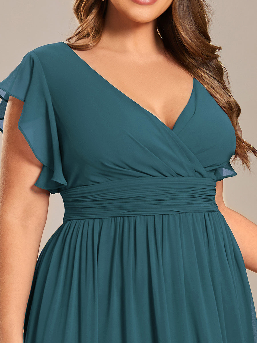 Robe de cérémonie femme, dos ouvert, col en V. Longue et fluide pour un look estival parfait et actuel.