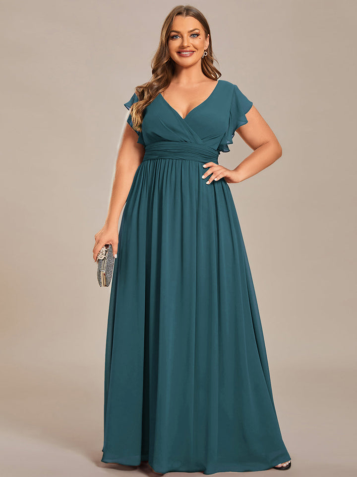 Robe fluide, dos ouvert, col en V. Élégante pour demoiselle d'honneur, longue et pour cérémonie estivale réussie.