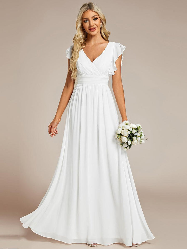 Robe longue de demoiselle d'honneur, élégante, dos ouvert, pour un look printanier raffiné.