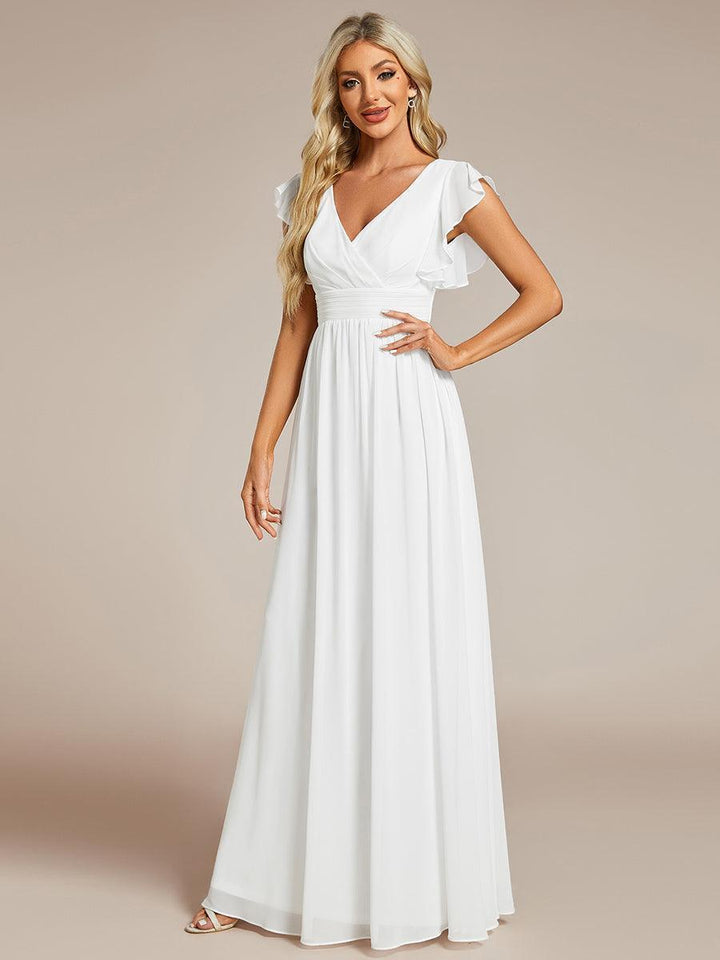 Robe de soirée élégante, dos ouvert, col en V, fluide. Idéale pour une fête ou un mariage maxi.