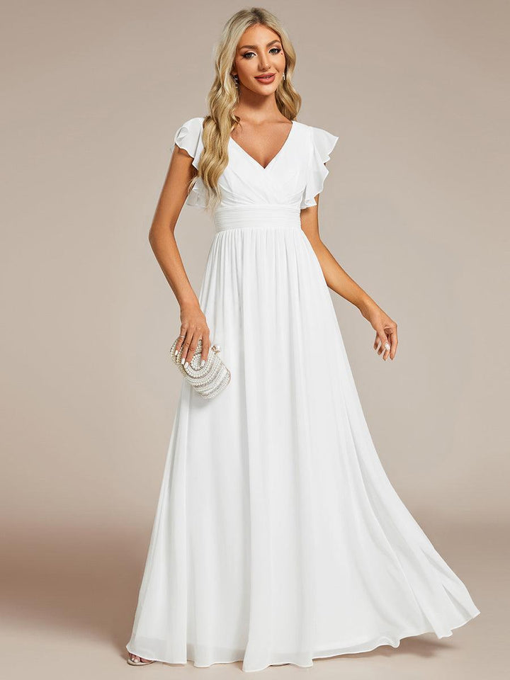 Robe de cérémonie chic, dos ouvert, manches courtes. Fluide et confortable pour toute femme.