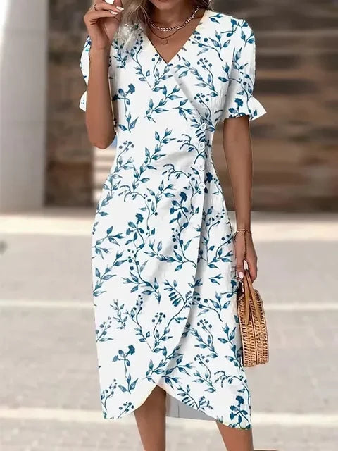 Robe midi fleurie pour femme, style bohème chic, idéale pour printemps et été.