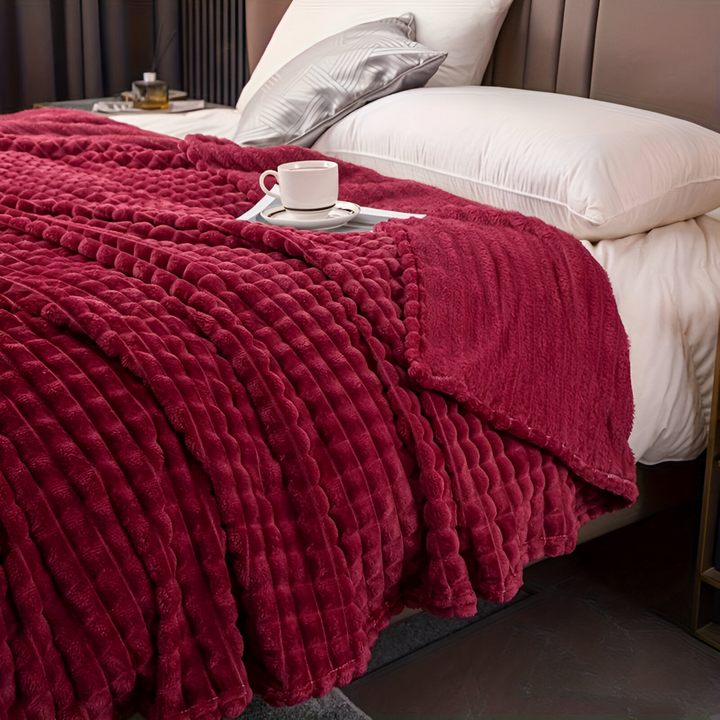 Plaid doux et chaud à carreaux, idéal pour un confort douillet à la maison.