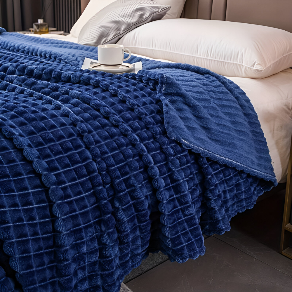 Plaid décoratif géométrique, couverture chaude et douce pour des soirées cocooning.