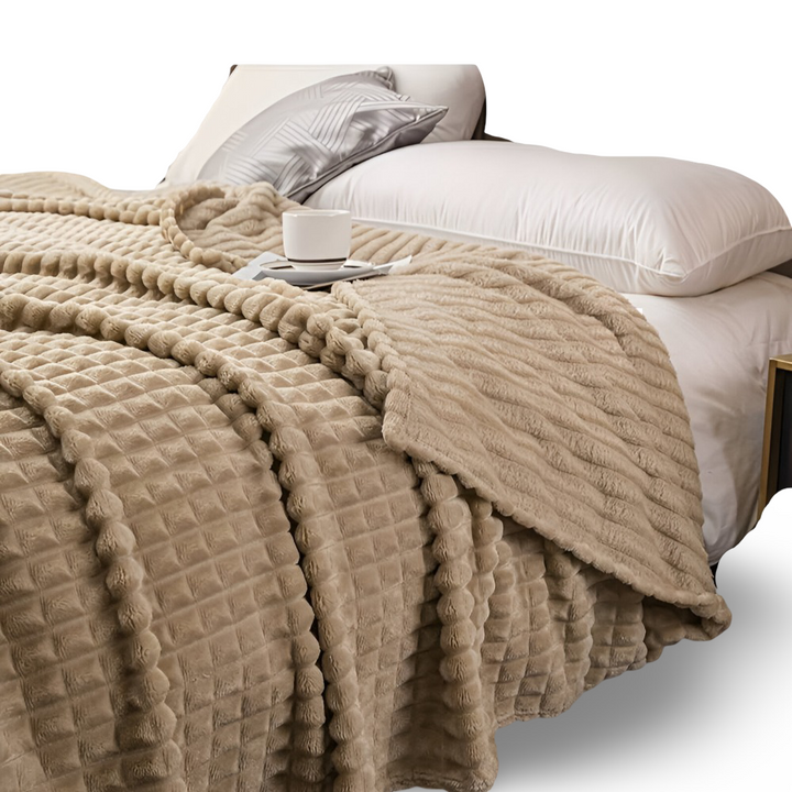 Jeté de canapé à carreaux élégant, plaid chaud et confortable pour un intérieur moderne.