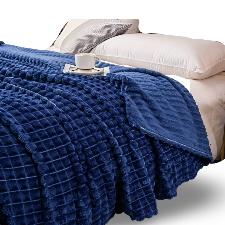 Couverture plaid chaude à motif géométrique, douce et réversible, pour un style maison unique.
