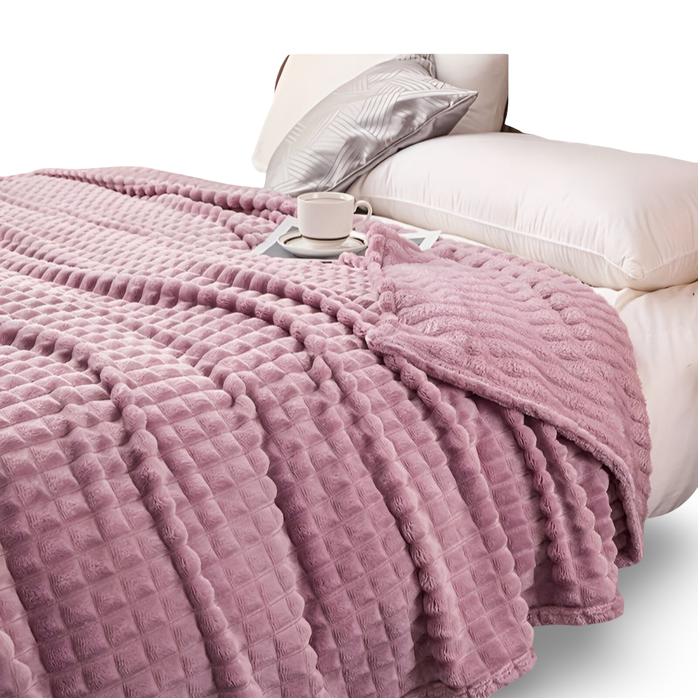 Plaid polaire à carreaux, chaud et réversible, un choix élégant pour le confort de la maison.