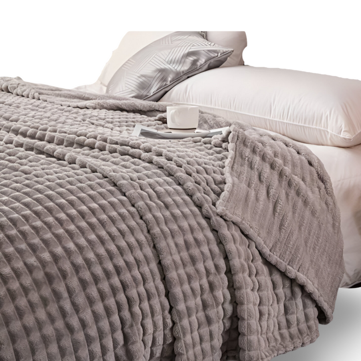 Plaid à carreaux géométriques, chaud et ultra doux, un élément de confort indispensable à la maison.