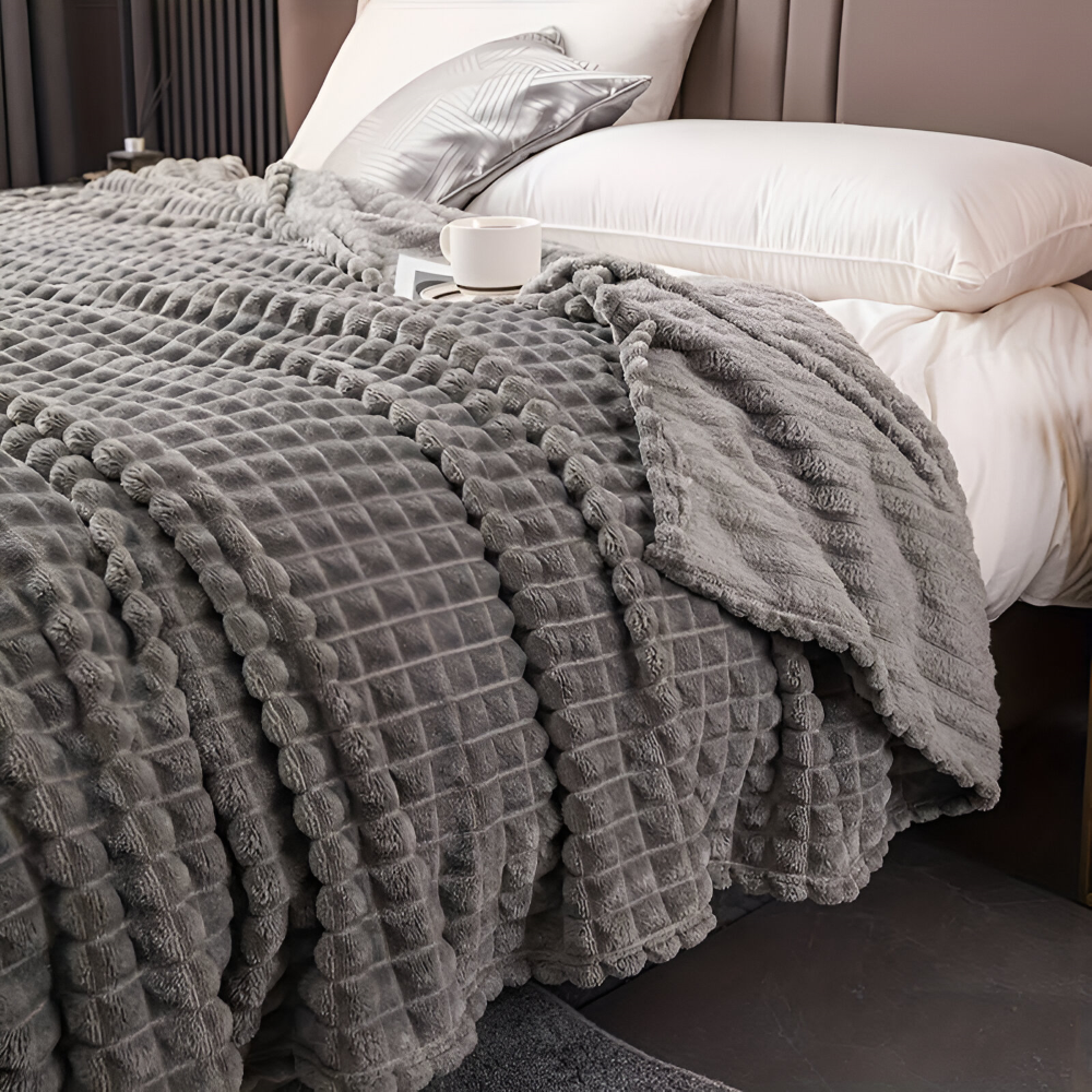 Jeté de lit décoratif à carreaux, plaid polaire chaud et élégant pour la chambre.