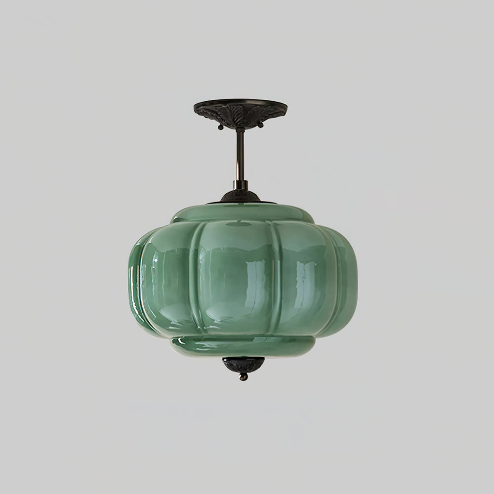 Lampe de plafond en verre, design pur et rond, offre une lumière douce et moderne.