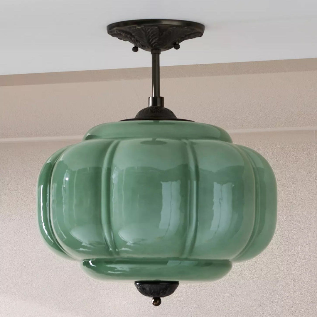 Lampe de plafond en verre, design élégant et moderne, forme sphérique, lumière harmonieuse.