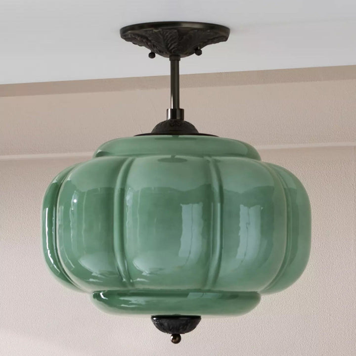 Lampe de plafond en verre, design élégant et moderne, forme sphérique, lumière harmonieuse.