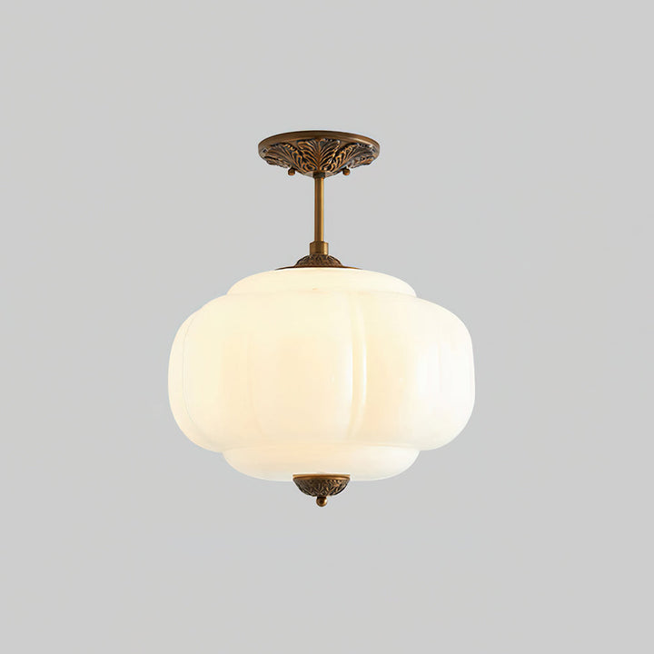 Plafonnier moderne en verre à forme arrondie pour un éclairage semi-encastré et raffiné.