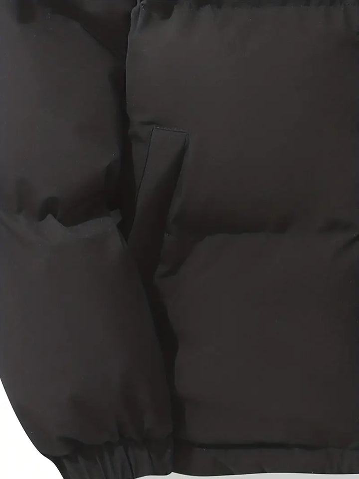 Gros plan sur le tissu matelassé de la veste Clara femme, texture douce et chaude.