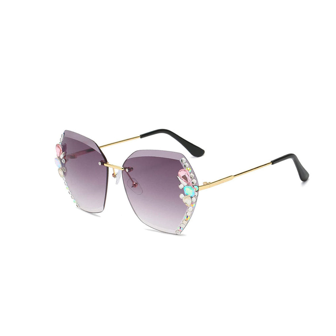 Lunettes de soleil vintage sans monture pour femmes, ornées de strass étincelants. Protection UV400, accessoire mode élégant.