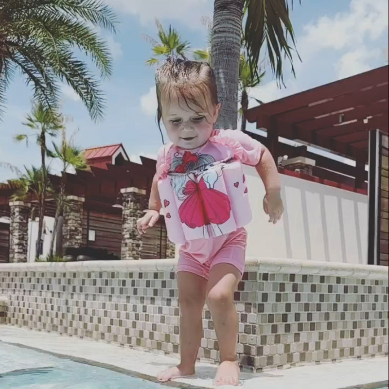 Maillot de bain SafeSwim fille à pois, flottant, garantit sécurité aquatique et fun en été.