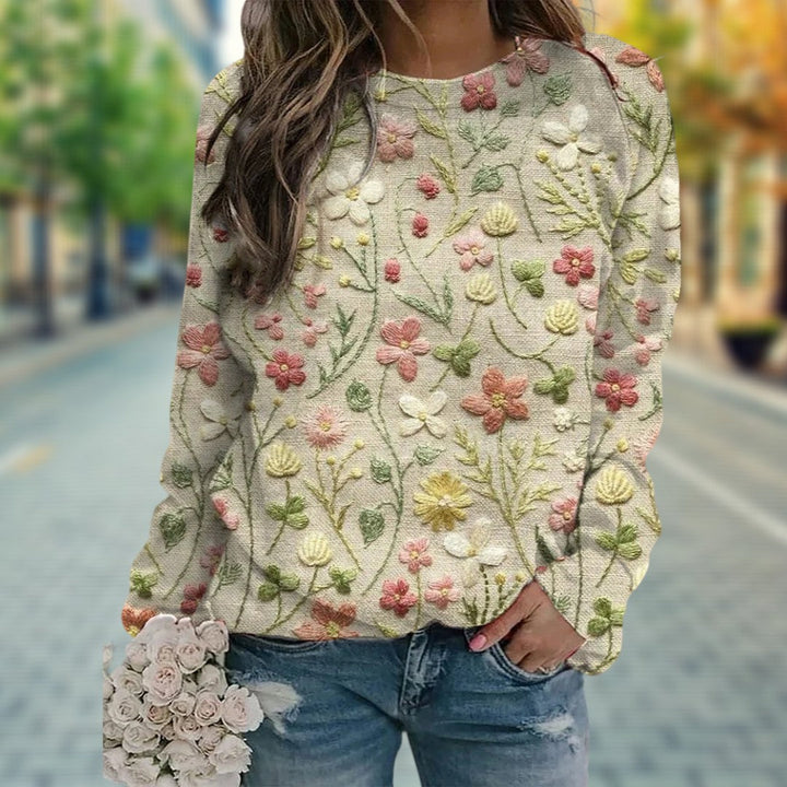 Mode femme : pull décontracté en tricot, motifs floraux en relief, idéal pour le printemps. Confort et style.