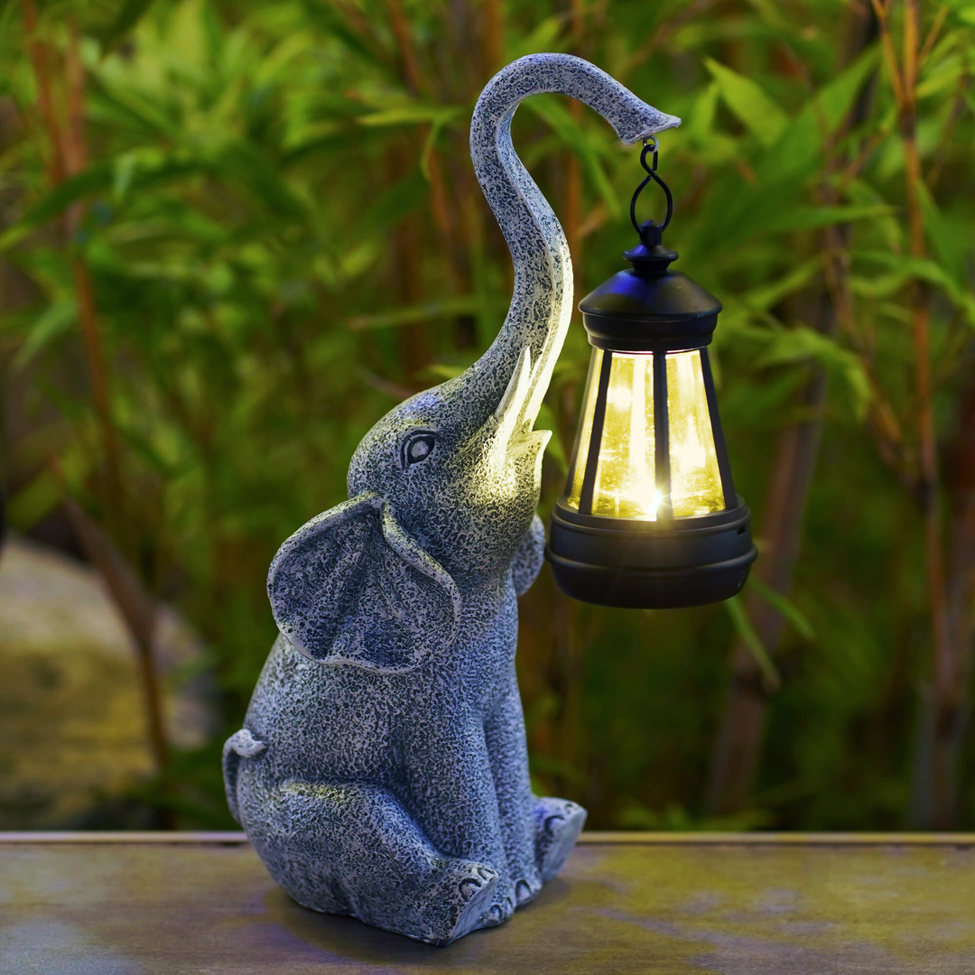 Lampe de jardin solaire en forme d'éléphant, luminaire extérieur décoratif et original en résine.