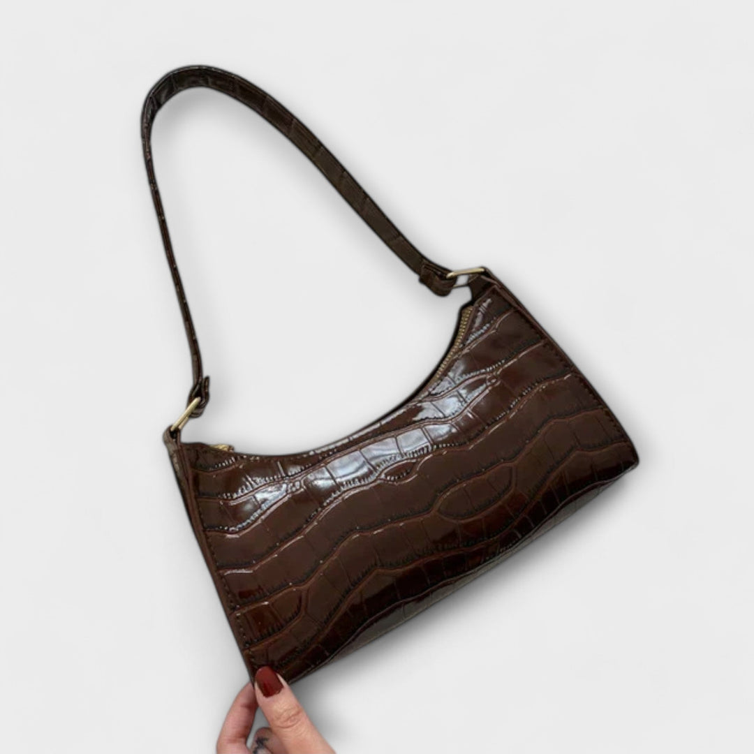 Sac à main jaune en cuir brillant, élégant et tendance, pour un look éclatant et moderne.