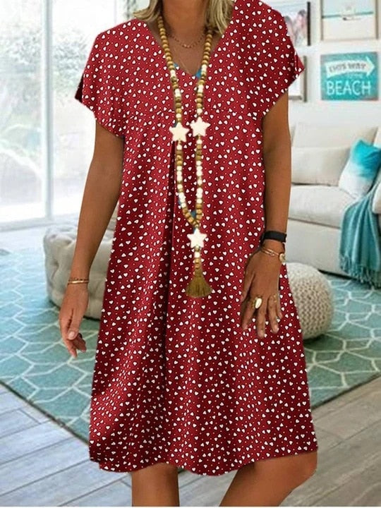 Robe midi femme estivale, parfaite pour le printemps et l'été. Élégante, fluide et confortable.