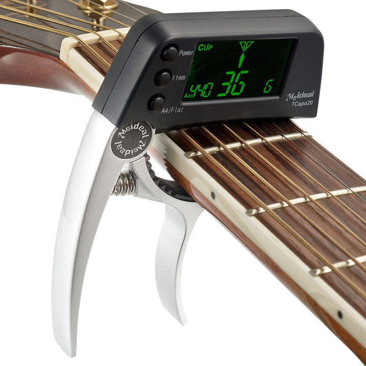 Capo ukulele et accordeur portable TuneGrip. Accordage rapide et simple pour musiciens.