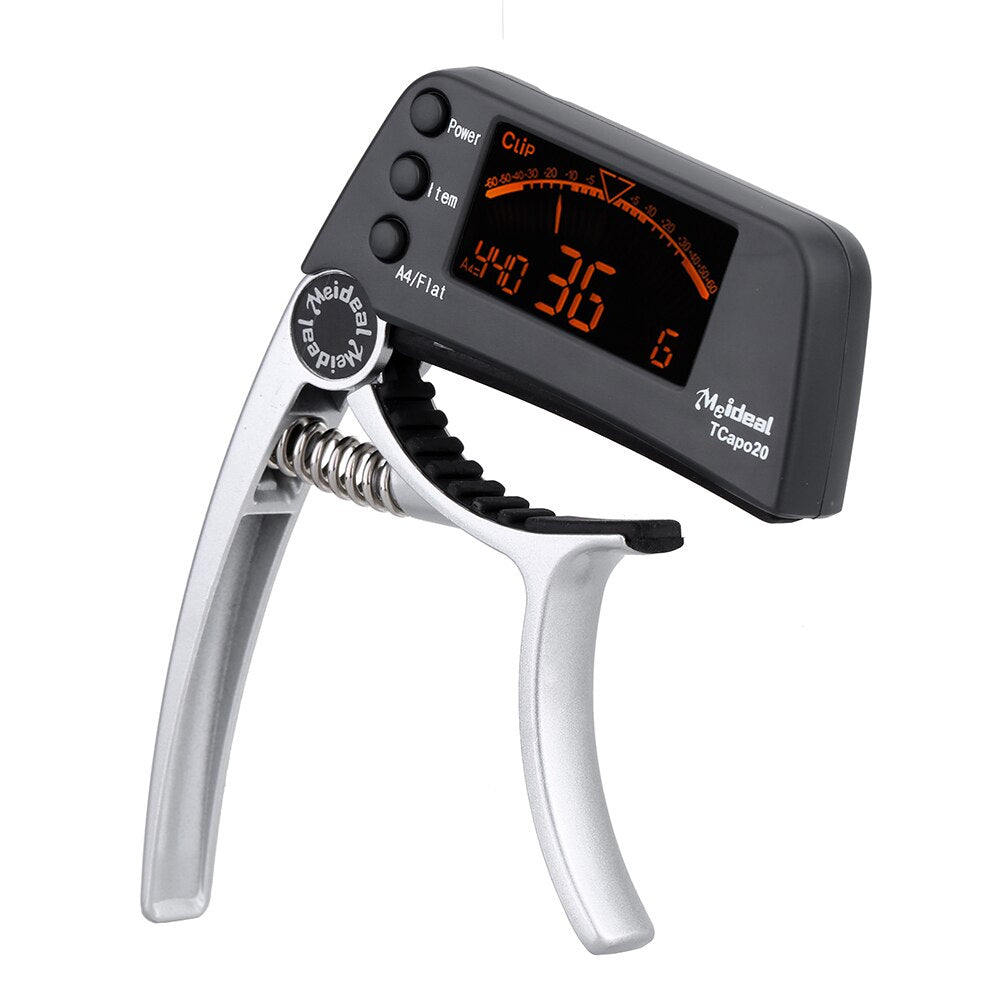 Accordeur basse et capo polyvalent TuneGrip, idéal pour la précision et le jeu sur scène.