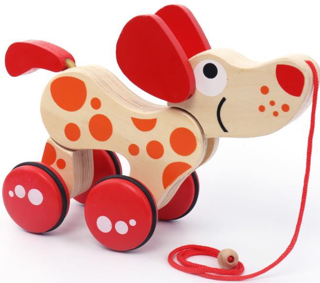 Jouet en bois à tirer chien et crocodile, stimulant le développement et l'apprentissage de la motricité des bébés.