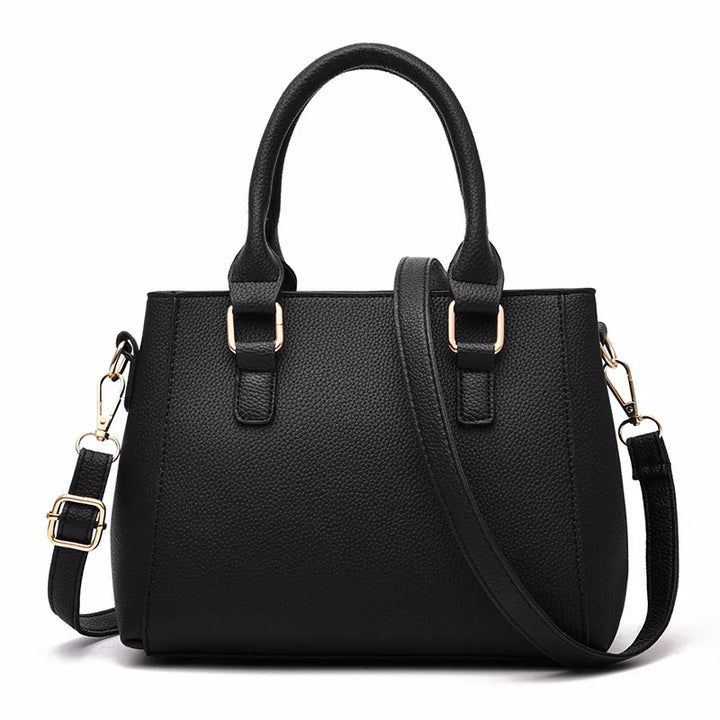 Sac femme en cuir brodé, style chic avec pompon décoratif. Élégance moderne pour toutes les occasions.