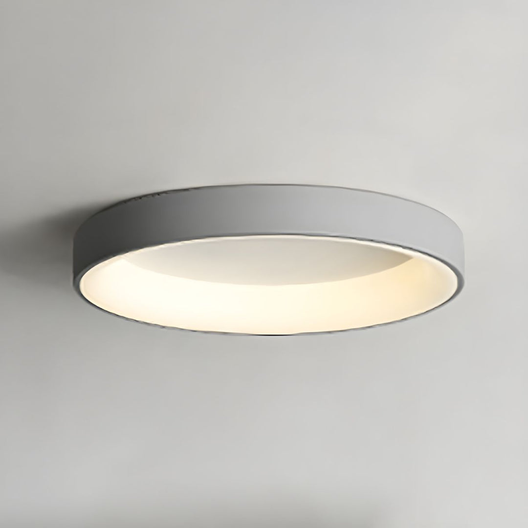 Plafonnier LED design rond, lumière ambiante et efficace, montage facile.