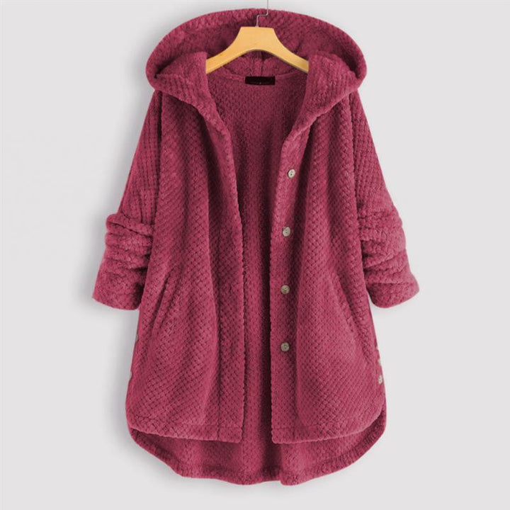 Dos de la veste réversible FleeceFinesse pour femme avec capuche, soulignant son confort et sa polyvalence.