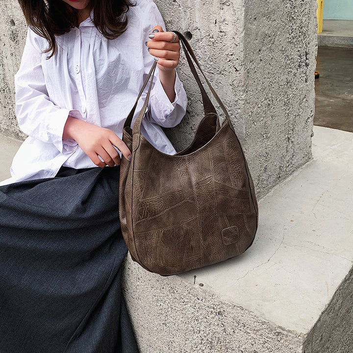 Sac femme en cuir véritable, style élégant, parfait pour le quotidien.