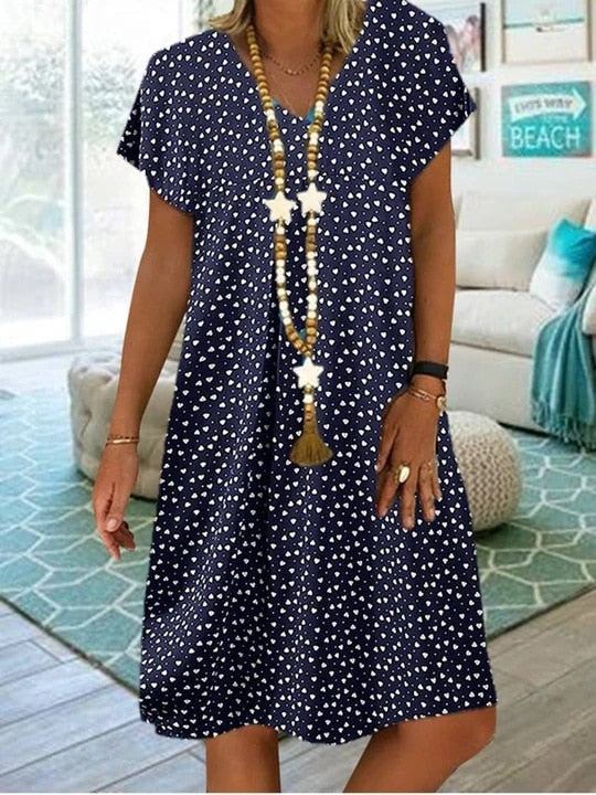 Robe midi femme élégante et fluide, idéale pour l'été. Tenue confortable et chic pour les vacances.