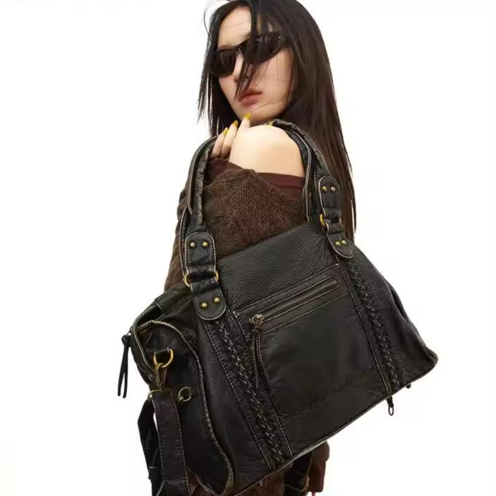 Sac à main femme en cuir véritable noir, style vintage et polyvalent, parfait pour un look raffiné.