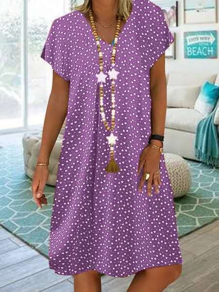 Robe midi chic et élégante pour femmes, parfaite pour l'été et les vacances. Tissu fluide.
