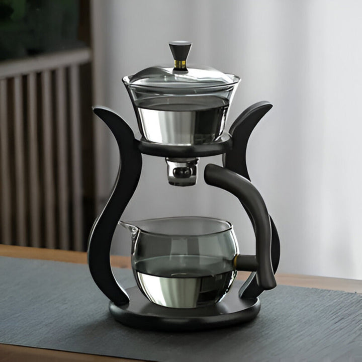 Ensemble infuseur à thé en verre avec support en bois, essentiel pour une dégustation raffinée du thé.