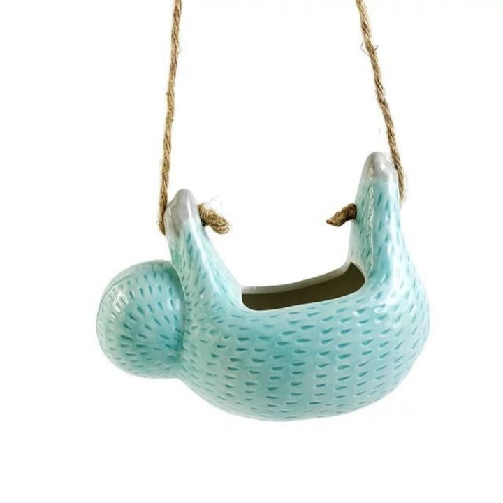 Idée cadeau : pot de fleurs céramique design paresseux pour plante d'intérieur, ajoute une touche originale.