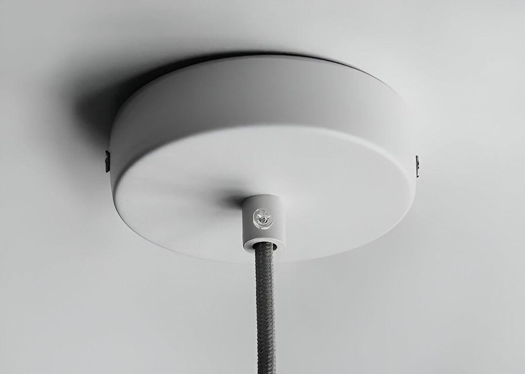 Lampe suspendue design macaron jaune, pour une touche nordique au salon.