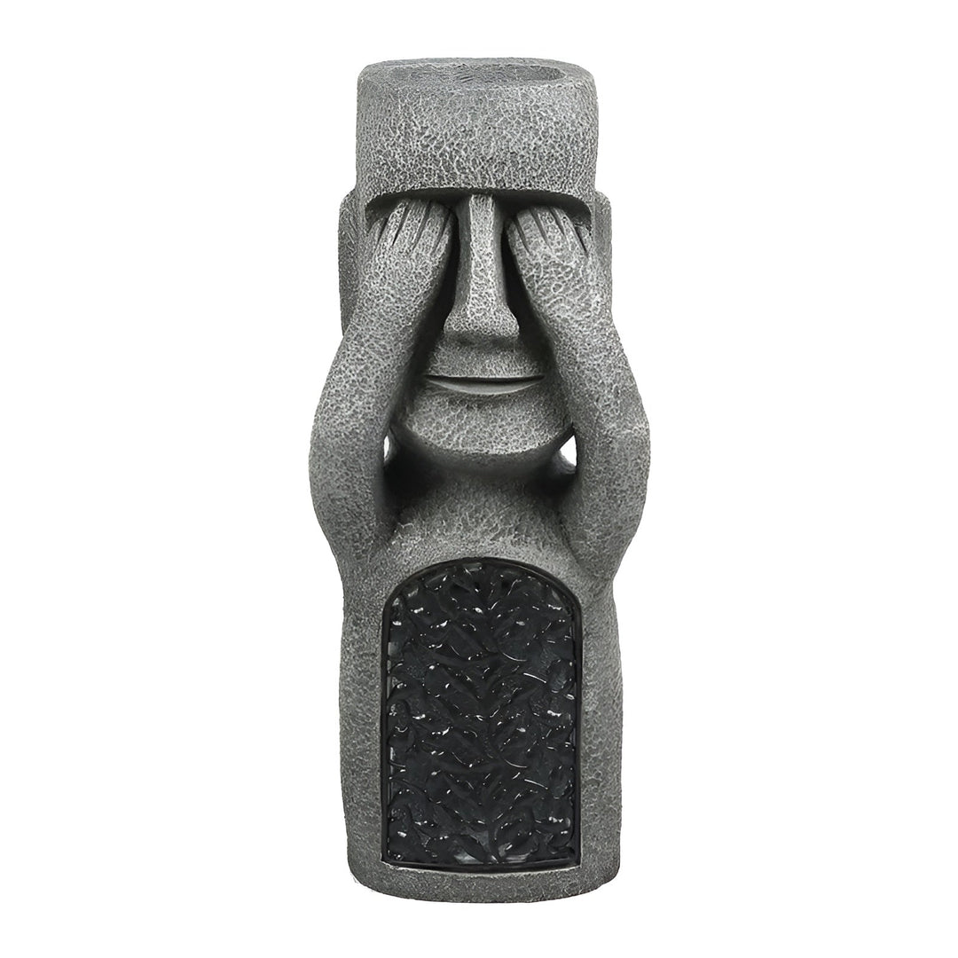 Statue Moai solaire éclairée, projetant une lumière douce et chaleureuse pour une ambiance zen nocturne au jardin.