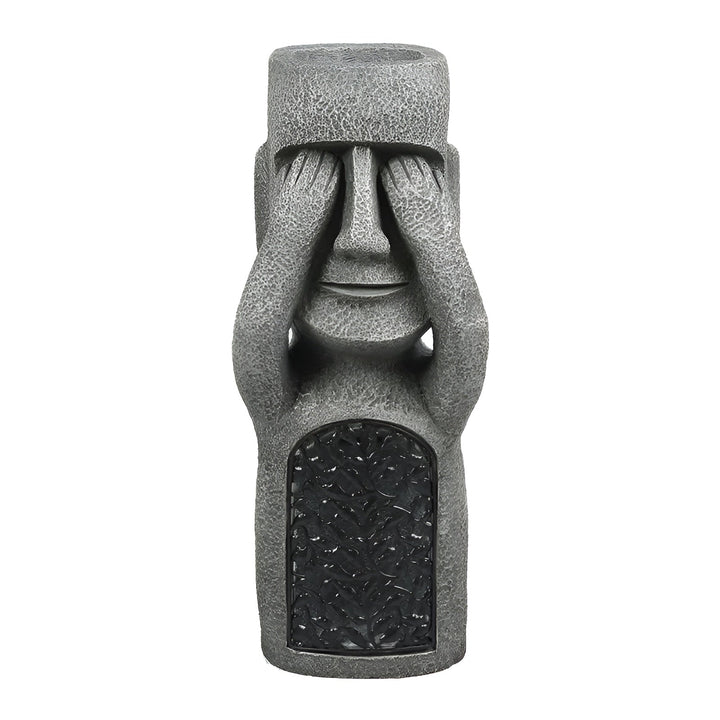 Statue Moai solaire éclairée, projetant une lumière douce et chaleureuse pour une ambiance zen nocturne au jardin.
